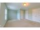 Bright bedroom featuring two closets, a window, neutral paint, and carpet at 151 Braeside Ct, Cary, NC 27519