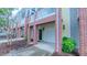 Exterior brick and siding townhome with individual garages at 151 Braeside Ct, Cary, NC 27519