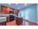 This kitchen is complete with stainless steel appliances, granite countertops, a center island, and ample cabinet space at 151 Braeside Ct, Cary, NC 27519