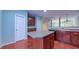 This kitchen has a center island, granite countertops, stainless appliances, and opens up to the living area at 151 Braeside Ct, Cary, NC 27519