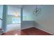 The living area offers lots of natural light with views of the backyard and updated modern lighting at 151 Braeside Ct, Cary, NC 27519