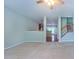 Spacious living room with a view of the kitchen, staircase, and entryway at 151 Braeside Ct, Cary, NC 27519