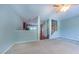 Open-concept living room with a view of the kitchen, staircase, and hardwood flooring at 151 Braeside Ct, Cary, NC 27519