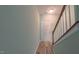 Entryway staircase with wooden handrail, leading to the upper level at 151 Braeside Ct, Cary, NC 27519