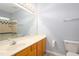 Bathroom features an extended vanity, toilet, shower, and tiled walls at 1510 Bungalow Ave, Durham, NC 27703