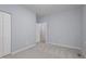 Light filled bedroom features neutral carpet, closet and pale blue walls at 1510 Bungalow Ave, Durham, NC 27703