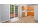 Functional kitchen with wood cabinets, white appliances, and sliding glass doors at 1510 Bungalow Ave, Durham, NC 27703