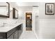 Bright bathroom features a double vanity and a view into the walk-in closet at 1535 Caraleigh Mills Ct # 111, Raleigh, NC 27603