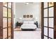 Inviting bedroom with a wrought-iron bed and decorative accents at 1535 Caraleigh Mills Ct # 111, Raleigh, NC 27603