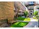 Landscaped courtyard with brick walkways and bench seating at 1535 Caraleigh Mills Ct # 111, Raleigh, NC 27603