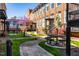Community courtyard with manicured lawn, walkways, and outdoor seating areas at 1535 Caraleigh Mills Ct # 111, Raleigh, NC 27603