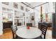 Open-concept dining area with hardwood floors and plenty of natural light from large windows at 1535 Caraleigh Mills Ct # 111, Raleigh, NC 27603