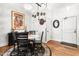 Charming dining area with marble-topped table, black chairs, and decorative wall accents at 1535 Caraleigh Mills Ct # 111, Raleigh, NC 27603