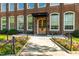 Beautiful brick building with large windows and a lovely flower bed along the sidewalk at 1535 Caraleigh Mills Ct # 111, Raleigh, NC 27603
