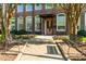 Beautiful brick building with large windows, benches, sidewalk and a lovely flower bed at 1535 Caraleigh Mills Ct # 111, Raleigh, NC 27603