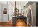 Contemporary kitchen with stainless steel appliances, center island, and hardwood floors at 1535 Caraleigh Mills Ct # 111, Raleigh, NC 27603