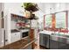 Practical laundry area with sink, washer, dryer, and storage shelves at 1535 Caraleigh Mills Ct # 111, Raleigh, NC 27603