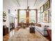 Charming living room with hardwood floors, exposed brick wall, and plenty of natural light at 1535 Caraleigh Mills Ct # 111, Raleigh, NC 27603