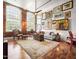 Spacious living room featuring hardwood floors, high ceilings, and an abundance of natural light at 1535 Caraleigh Mills Ct # 111, Raleigh, NC 27603