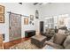 Comfortable living room with sliding barn door to the right, and sectional sofa at 1535 Caraleigh Mills Ct # 111, Raleigh, NC 27603