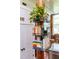 Stylish corner shelf with books and potted plants at 1535 Caraleigh Mills Ct # 111, Raleigh, NC 27603