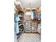 Walk-in closet features custom shelving for shoes, clothes, and accessories at 1535 Caraleigh Mills Ct # 111, Raleigh, NC 27603
