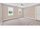Cozy bedroom filled with natural light from two windows, creating a bright and welcoming space at 1605 Baneberry Ct, Willow Springs, NC 27592