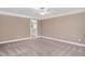 Bedroom featuring neutral carpet and paint, with bathroom access at 1605 Baneberry Ct, Willow Springs, NC 27592