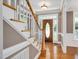 Inviting foyer with hardwood floors, wainscoting and a striking wood front door at 1605 Baneberry Ct, Willow Springs, NC 27592
