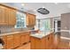 Well-appointed kitchen with an island, granite countertops, and pendant lighting at 1605 Baneberry Ct, Willow Springs, NC 27592