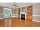 Comfortable living room with a fireplace, built-in shelving, and access to the deck at 1605 Baneberry Ct, Willow Springs, NC 27592