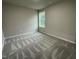 A cozy bedroom featuring neutral walls, carpet, and a single window at 170 Starry Sky Dr, Benson, NC 27504