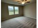 Cozy bedroom with soft carpeting and lots of natural light at 170 Starry Sky Dr, Benson, NC 27504
