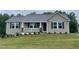 Charming single-story home with a covered front porch and well-maintained lawn at 170 Starry Sky Dr, Benson, NC 27504