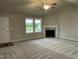 Inviting living room with a cozy fireplace and plenty of natural light at 170 Starry Sky Dr, Benson, NC 27504