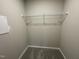 Walk-in closet with carpet flooring and shelf for storage at 170 Starry Sky Dr, Benson, NC 27504