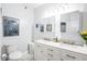 Modern bathroom featuring double sinks, a vanity, and a marble countertop at 1700 Tiffany Bay Ct # 303, Raleigh, NC 27609