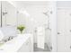 Bright bathroom with glass shower, white vanity, and modern fixtures at 1700 Tiffany Bay Ct # 303, Raleigh, NC 27609