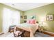 Comfortable bedroom with hardwood floors, a cozy bed, and a bright window at 1700 Tiffany Bay Ct # 303, Raleigh, NC 27609