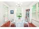 Bright dining room with glass table, white chairs, and natural light at 1700 Tiffany Bay Ct # 303, Raleigh, NC 27609