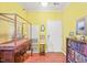 Inviting entryway with hardwood floors and curated display of art, antiques, and books at 1700 Tiffany Bay Ct # 303, Raleigh, NC 27609