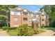 Inviting condo with brick and siding exterior, balconies and landscaped grounds at 1700 Tiffany Bay Ct # 303, Raleigh, NC 27609