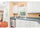 Kitchen sink with window, stained glass accent, and stainless steel dishwasher at 1700 Tiffany Bay Ct # 303, Raleigh, NC 27609