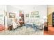 Bright living room showcasing stylish furniture, books and wood flooring at 1700 Tiffany Bay Ct # 303, Raleigh, NC 27609