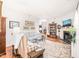 Bright living room with hardwood floors, fireplace, and bookshelves at 1700 Tiffany Bay Ct # 303, Raleigh, NC 27609