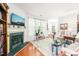 Comfortable living room with fireplace, TV and open layout to the dining area at 1700 Tiffany Bay Ct # 303, Raleigh, NC 27609