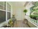 Relaxing porch with chairs and plants overlooking the exterior at 1700 Tiffany Bay Ct # 303, Raleigh, NC 27609