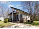 Attractive home featuring unique roofline and inviting front entrance with stone stairs at 1809 Coltrane Ct, Raleigh, NC 27610
