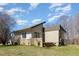 Side and rear exterior view of a home with a multi-level deck and grassy yard at 1809 Coltrane Ct, Raleigh, NC 27610