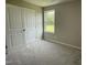 Bedroom with a window and double door closet, perfect for a room at 186 Coharie Dr, Lillington, NC 27546